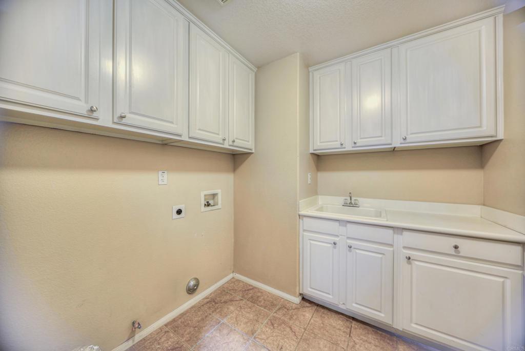 32215 Vía Bejarano Temecula, CA 92592 - Photo 40 of 42 a view of cabinets and wooden floor