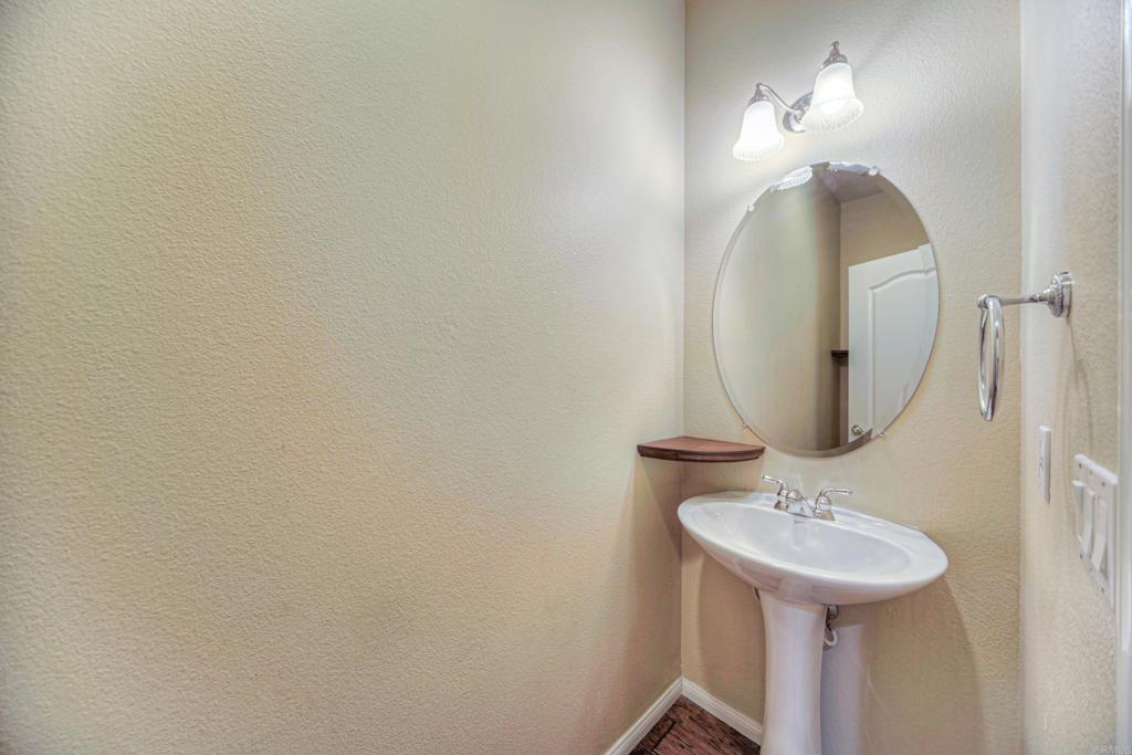 32215 Vía Bejarano Temecula, CA 92592 - Photo 41 of 42 a bathroom with a sink and mirror