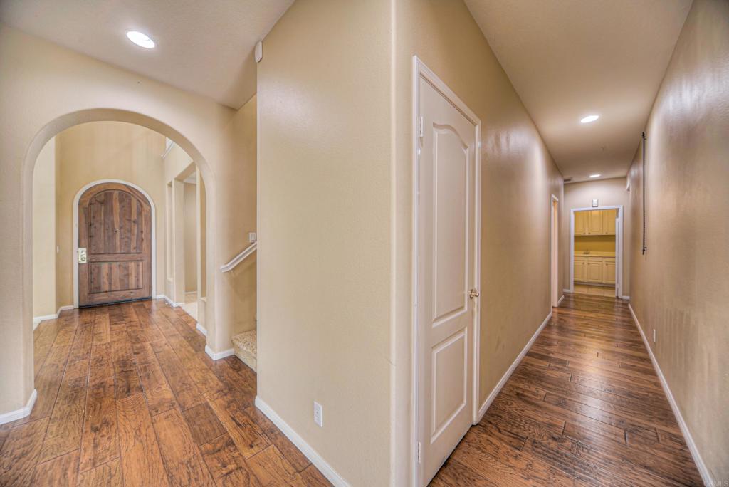 32215 Vía Bejarano Temecula, CA 92592 - Photo 42 of 42 a view of a hallway with wooden floor