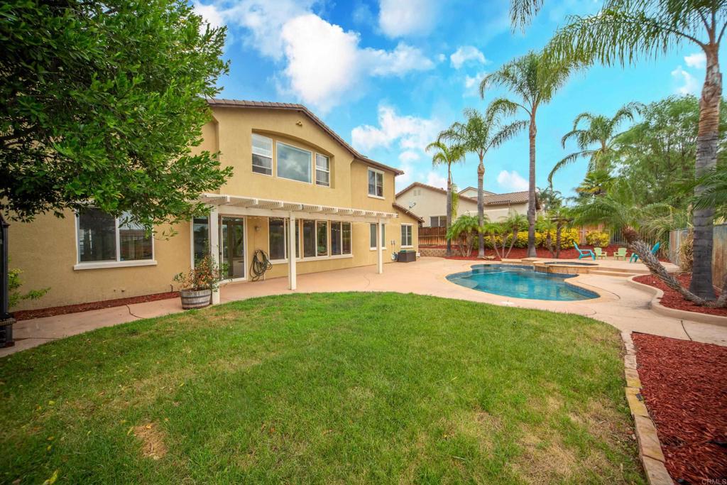 32215 Vía Bejarano Temecula, CA 92592 - Photo 5 of 42 a view of a house with a yard