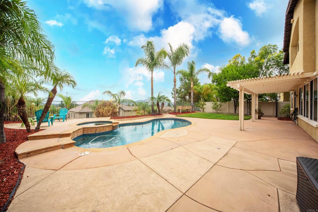 32215 Vía Bejarano Temecula, CA 92592 - Photo 6 of 42 a view of a swimming pool with a patio