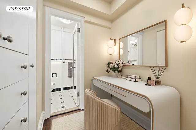 a bedroom with a bed wooden floor and window