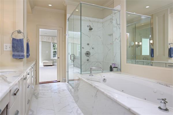 26 Braddock Park Boston, MA 02116 - Photo 20 of 25 a bathroom with a bathtub shower and a sink