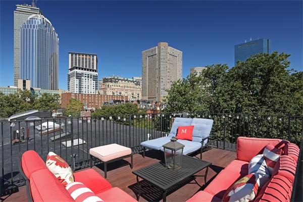26 Braddock Park Boston, MA 02116 - Photo 24 of 25 a outdoor sitting area with furniture and wooden floor