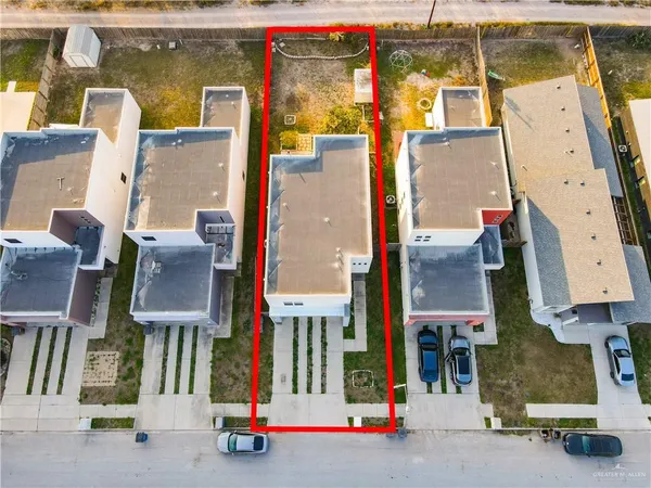 an aerial view of houses with street