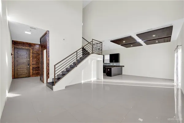 a view of a hallway with stairs