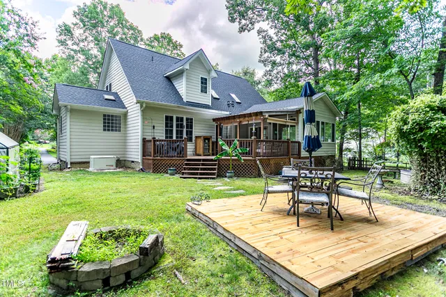 a view of a chair and tables in the backyard