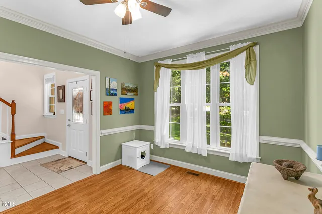 a view of a house with backyard sitting area and garden