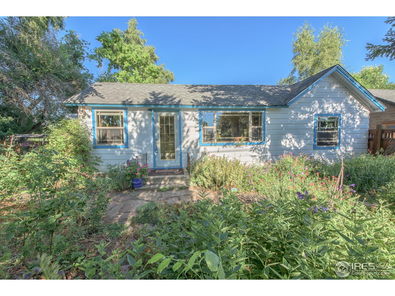 1065 Cherryvale Road Boulder, CO 80303 - Photo 1 of 24 a front view of a house with a garden