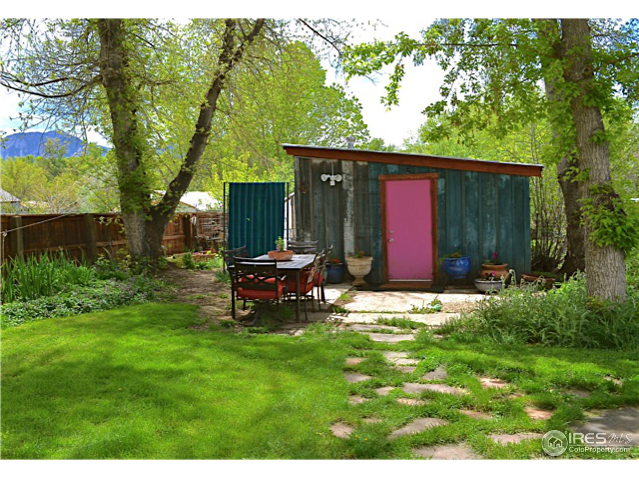 1065 Cherryvale Road Boulder, CO 80303 - Photo 16 of 24 a backyard of a house with table and chairs