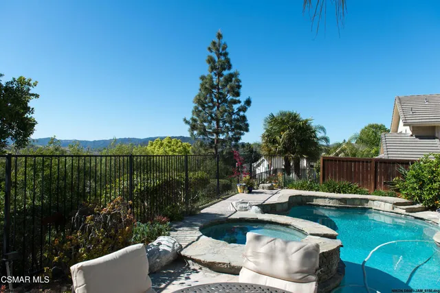 a view of swimming pool from a balcony