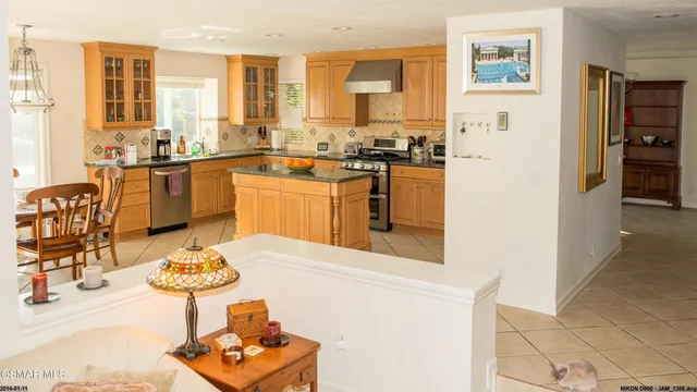 a kitchen with a sink stove and refrigerator