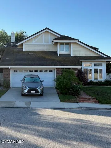 a car parked in front of a house