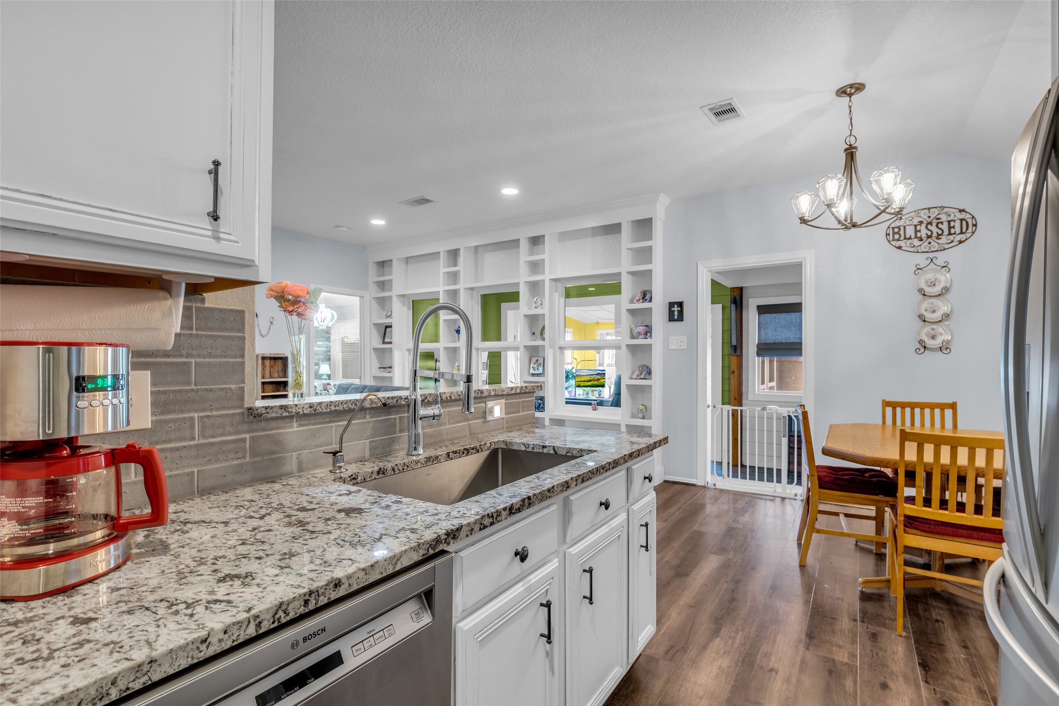 242 Sunset Path North Conroe, TX 77316 - Photo 8 of 37 Your updated command center! Stay involved with going's on in the Living Room, Dining Area, Flex Space and Sunroom! 242 SUNSET PATH N - Request your tour today!