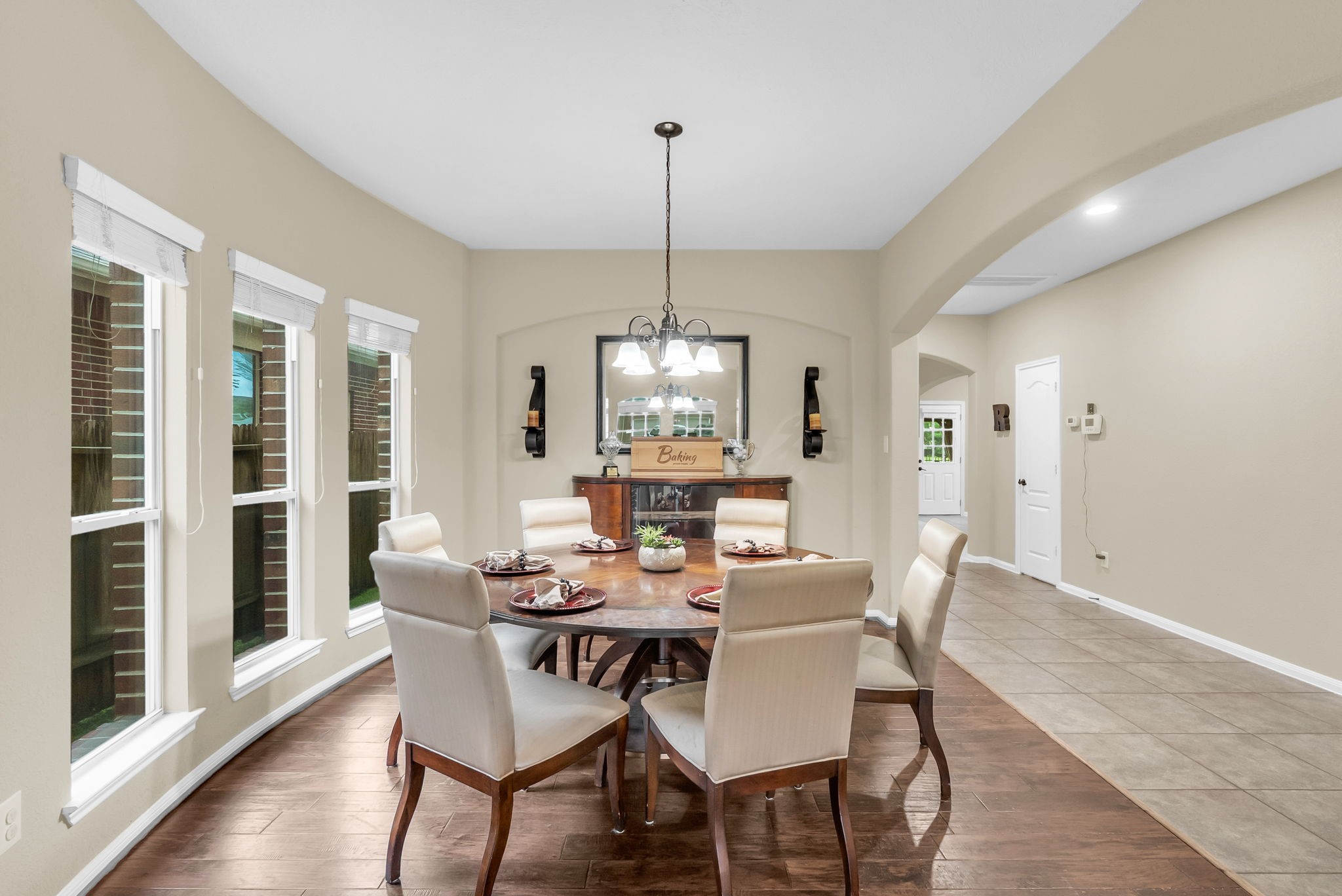 16619 Dover Mills Drive Spring, TX 77379 - Photo 10 of 49 a dining room with furniture a chandelier and wooden floor