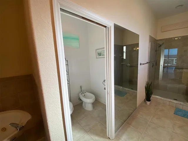 a view of a house with a wooden deck