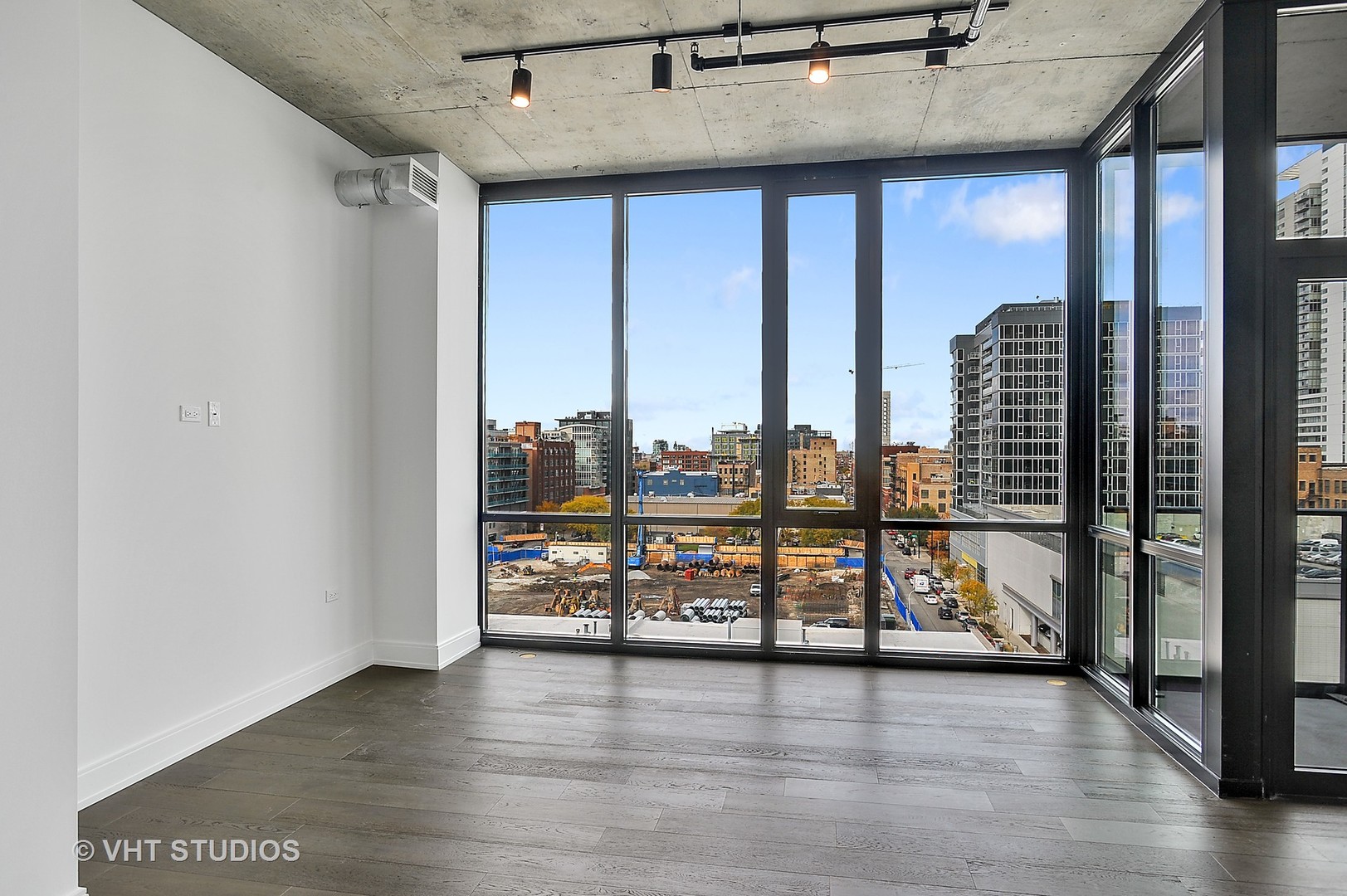 111 South Peoria Street, Unit 804 Chicago, IL 60607 - Photo 13 of 33 an empty room with wooden floor and windows