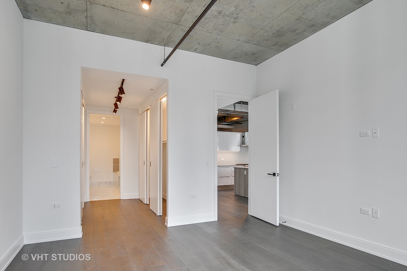 111 South Peoria Street, Unit 804 Chicago, IL 60607 - Photo 16 of 33 a view of a hallway with wooden floor