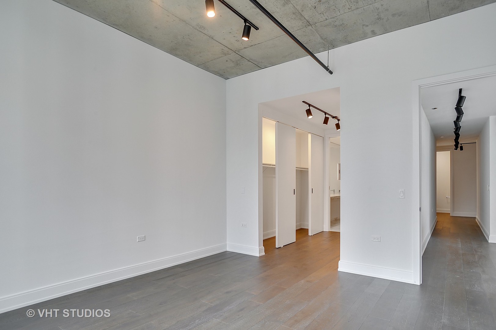 111 South Peoria Street, Unit 804 Chicago, IL 60607 - Photo 17 of 33 a view of a hallway with wooden floor