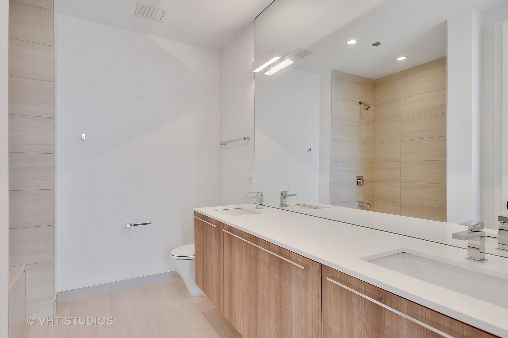 111 South Peoria Street, Unit 804 Chicago, IL 60607 - Photo 24 of 33 a bathroom with a sink and a mirror
