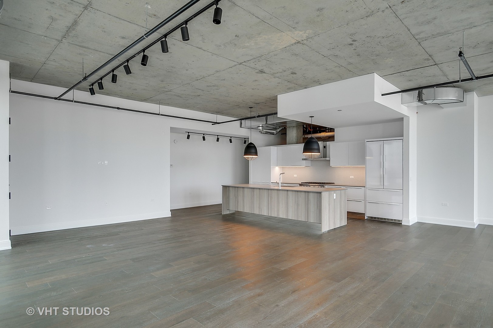 111 South Peoria Street, Unit 804 Chicago, IL 60607 - Photo 5 of 33 a kitchen with stainless steel appliances granite countertop a lot of cabinets and wooden floor