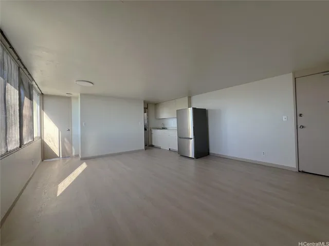 a view of empty room with closet and stairs