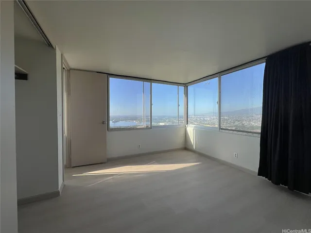 a view of an empty room with a window