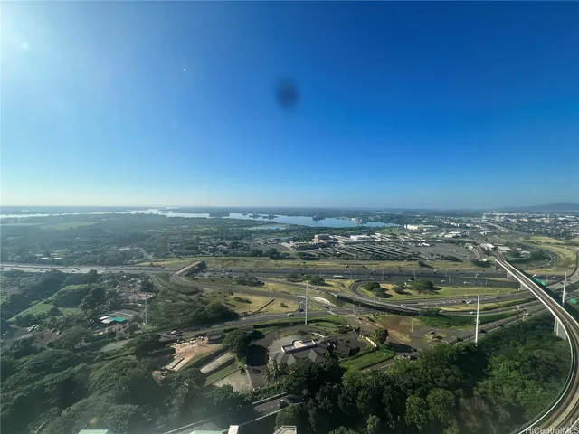 an aerial view of residential building and trees around