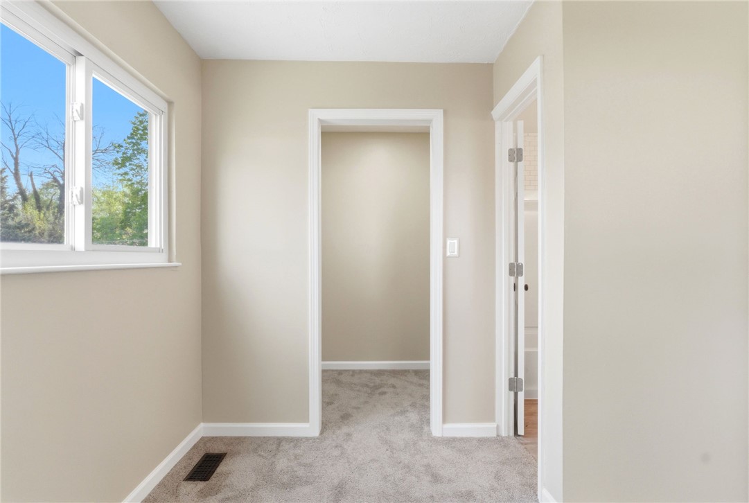 40 Woods Road Springboro, OH 45066 - Photo 56 of 57 This versatile room features natural light and soft carpeting, offering a comfortable and adaptable living space.