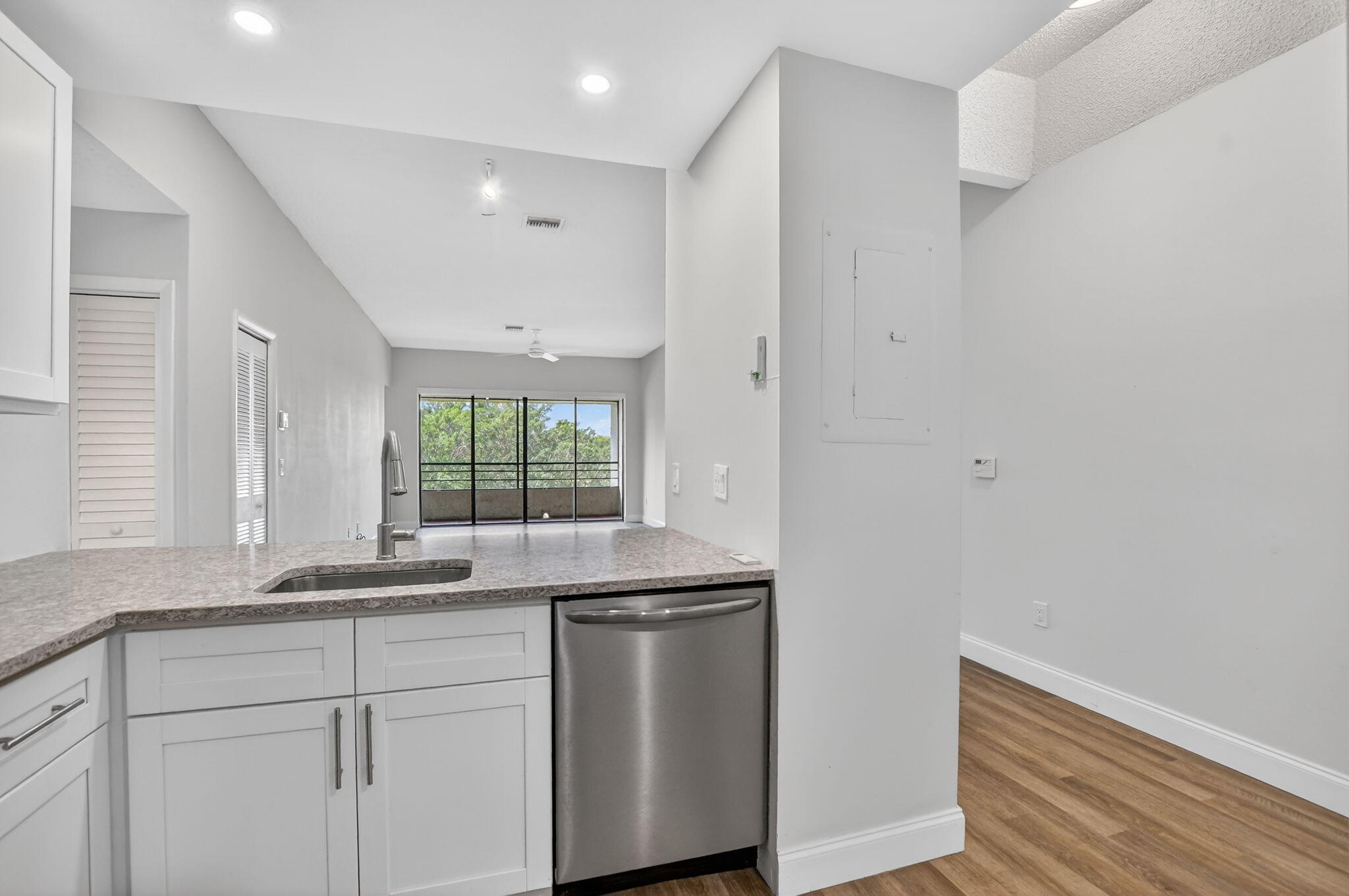 7472 La Paz Boulevard, Unit 304 Boca Raton, FL 33433 - Photo 11 of 36 a kitchen with a sink and window