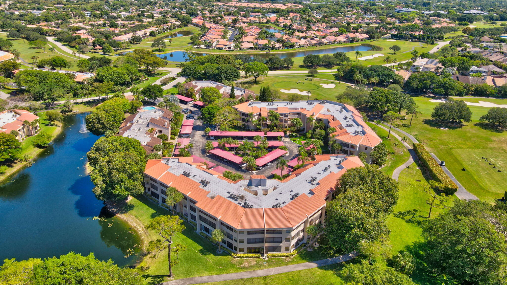 7472 La Paz Boulevard, Unit 304 Boca Raton, FL 33433 - Photo 32 of 36 an aerial view of a city