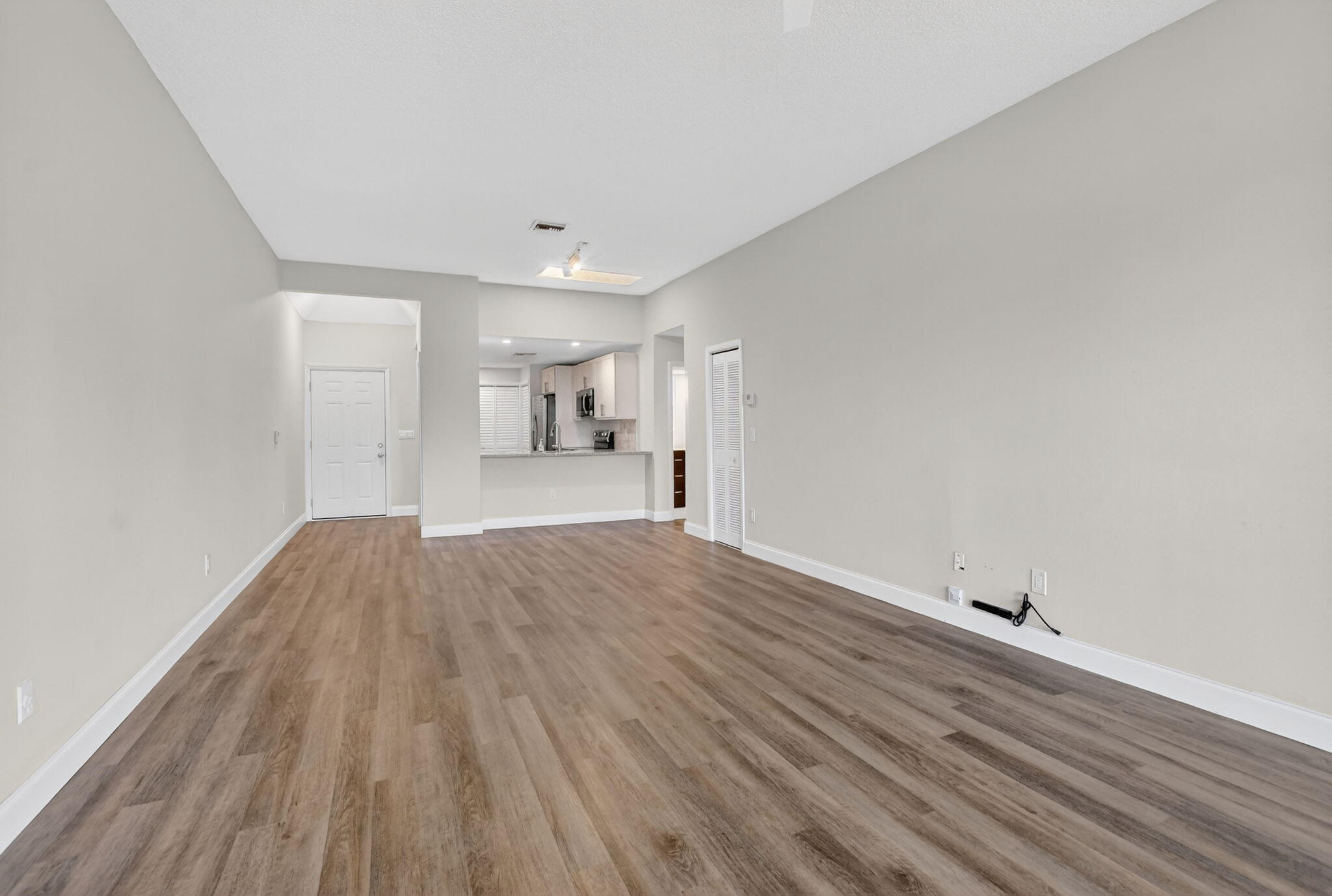 7472 La Paz Boulevard, Unit 304 Boca Raton, FL 33433 - Photo 7 of 36 a view of empty room with wooden floor