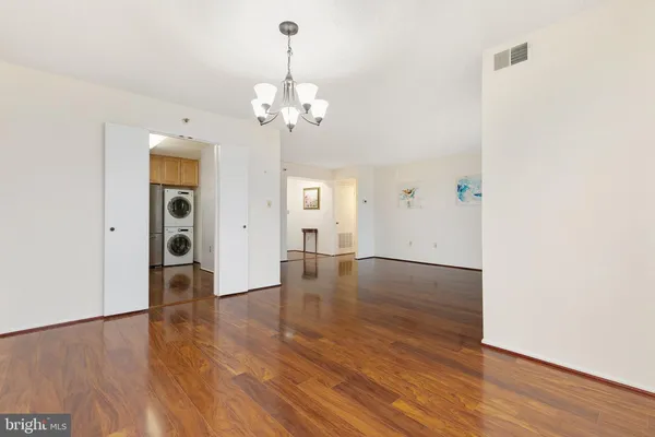 a view of a livingroom with wooden floor