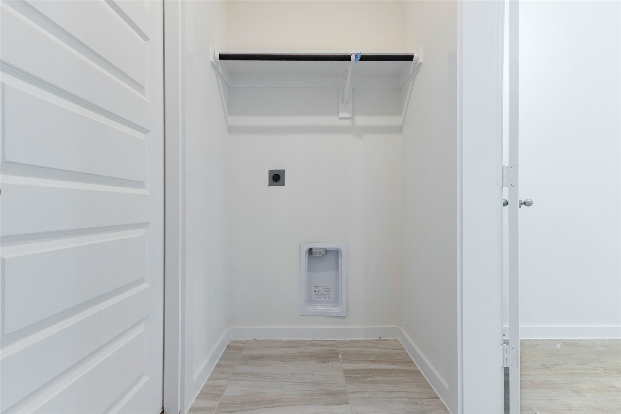 1115 Santee Court Rosharon, TX 77583 - Photo 11 of 23 The laundry room offers dedicated hookups, a built-in shelf above for detergent and supplies and a full-size door that keeps the noise out of the living space. Tile flooring cleans up easily, and the room is sized to fit a stacked or side-by-side washer and dryer. Having laundry close to the bedrooms saves steps and makes weekly chores simpler.