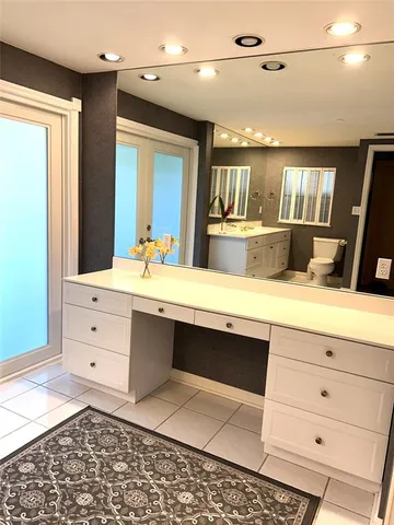 a bathroom with a double vanity sink a mirror and shower