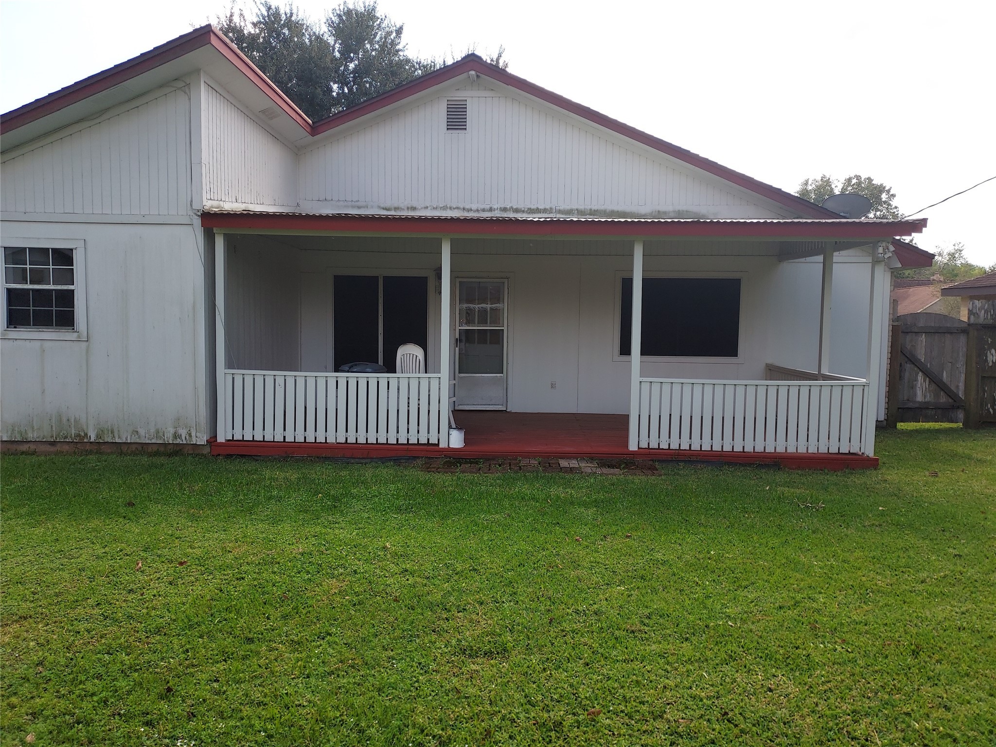 1305 Sagebrush Street Angleton, TX 77515 - Photo 12 of 12 a view of a house with a yard and deck