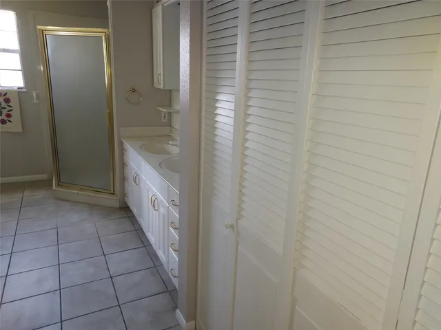 a bathroom with a bathtub and shower