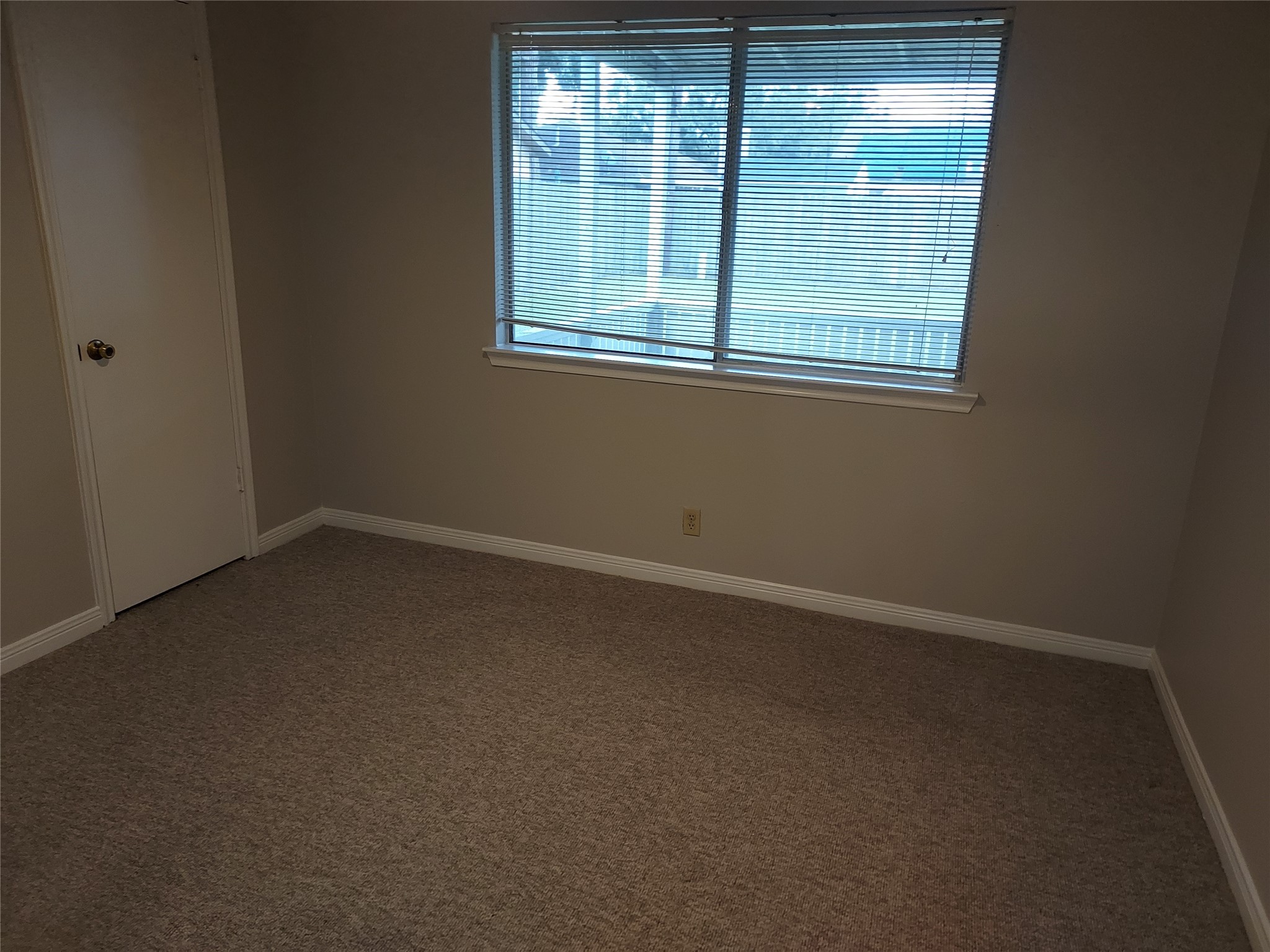 1305 Sagebrush Street Angleton, TX 77515 - Photo 8 of 12 an empty room with a window