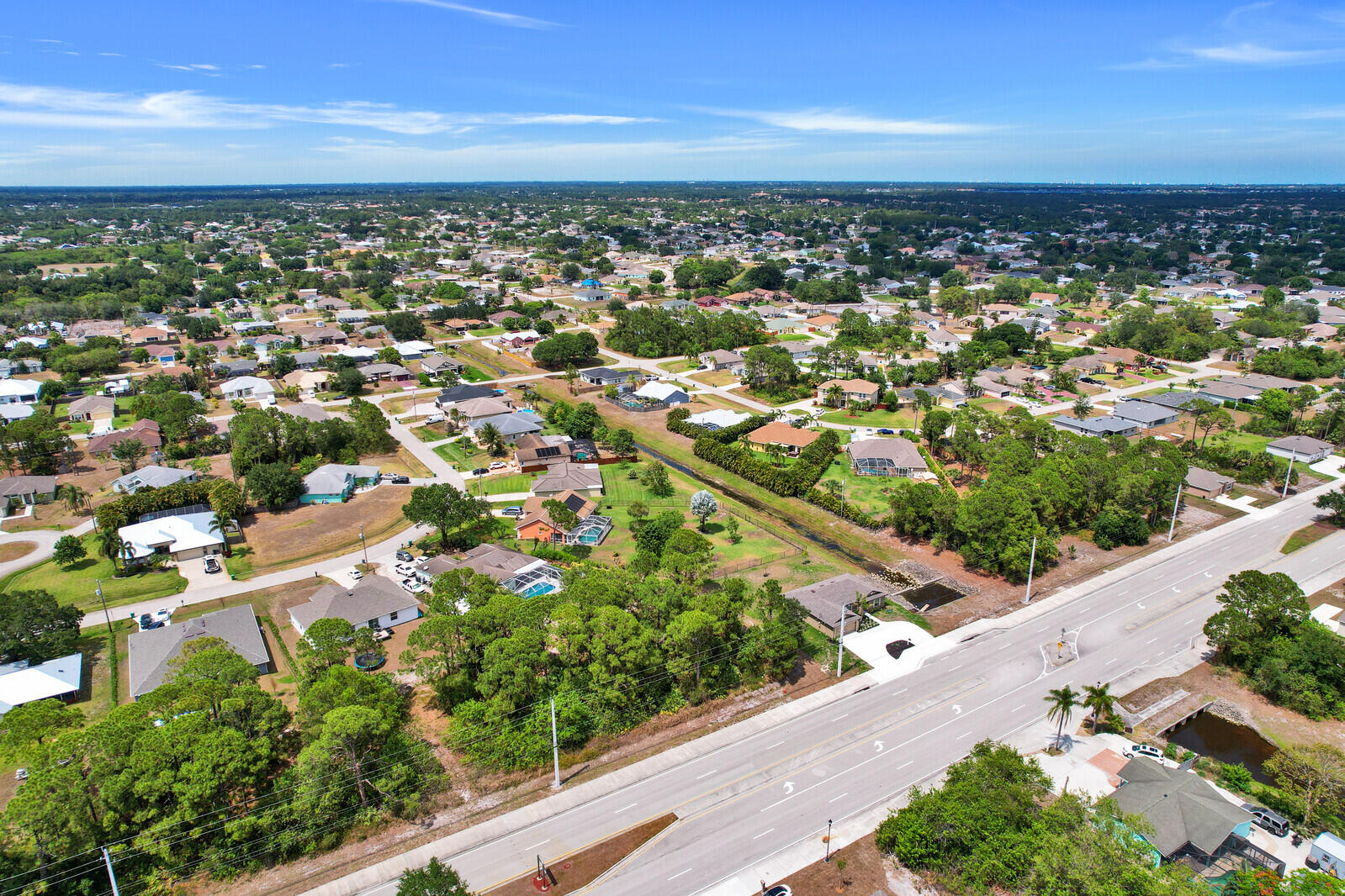 243 Southwest Becker Road Port St. Lucie, FL 34953 - Photo 6 of 20 an aerial view of residential houses with outdoor space