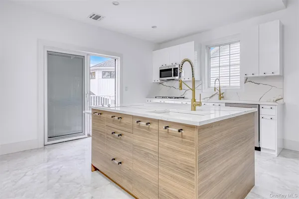 a bathroom with a sink double vanity and mirror