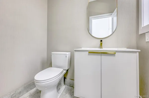 a bathroom with a toilet and a sink