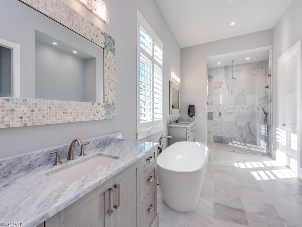 16892 Brightling Way Naples, FL 34110 - Photo 9 of 33 a bathroom with a granite countertop sink toilet and shower
