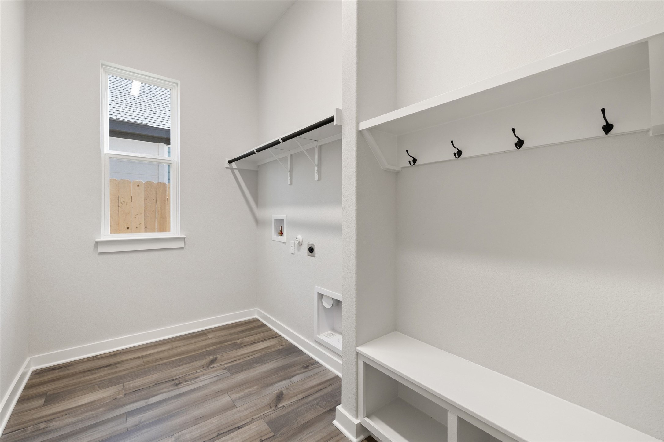 16309 Smithers Road Manor, TX 78653 - Photo 11 of 40 a view of room with window and hardwood floor