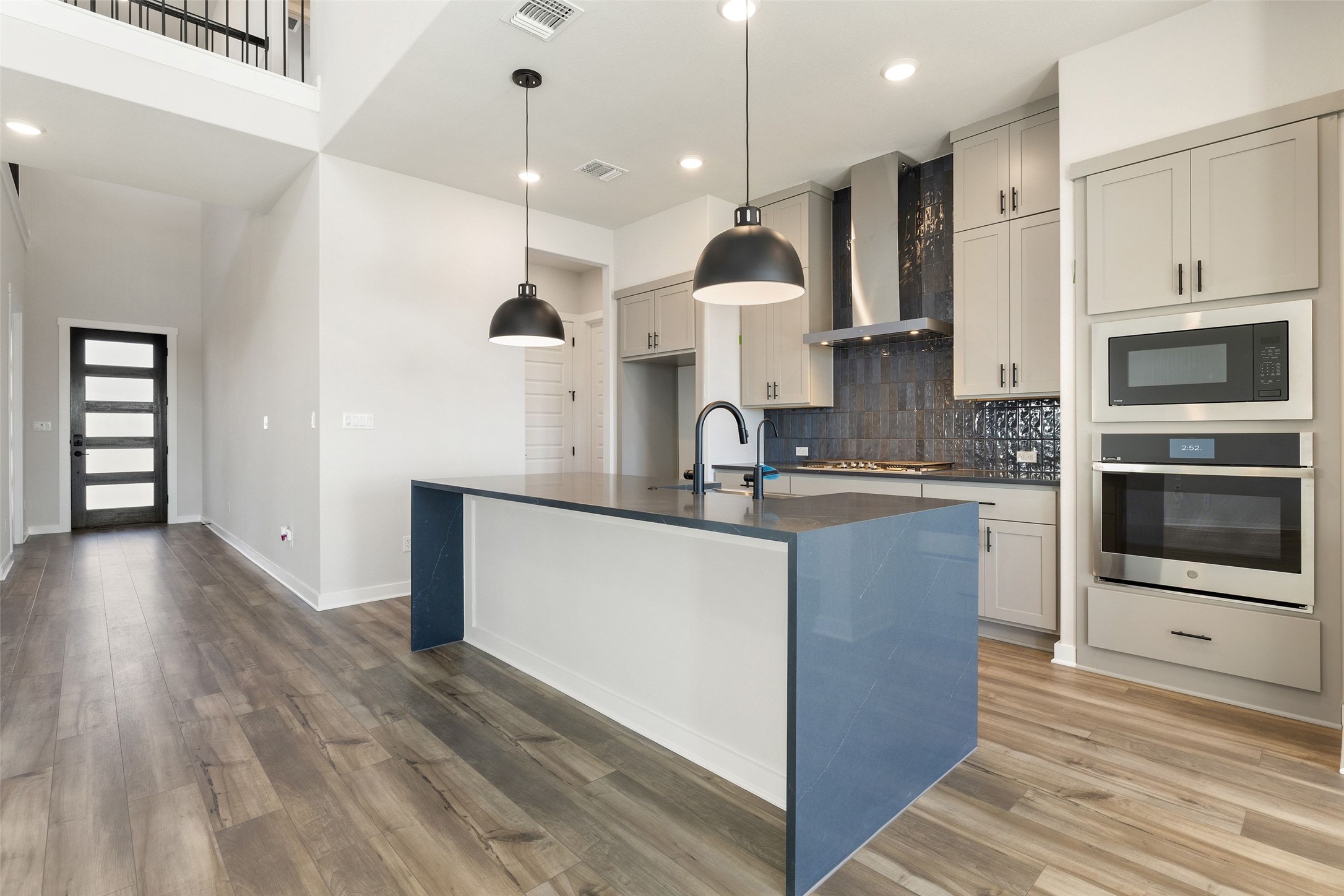 16309 Smithers Road Manor, TX 78653 - Photo 15 of 40 a kitchen with stainless steel appliances granite countertop a sink a stove and a refrigerator
