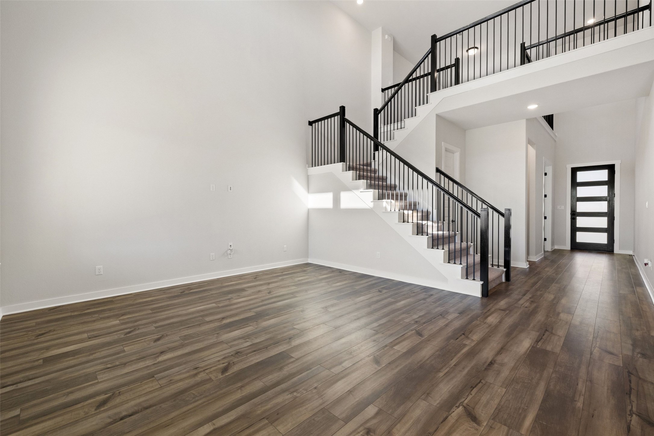 16309 Smithers Road Manor, TX 78653 - Photo 17 of 40 a view of entryway with wooden floor