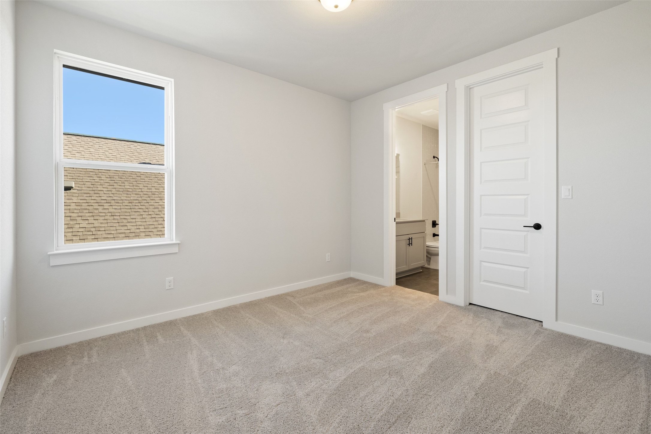 16309 Smithers Road Manor, TX 78653 - Photo 29 of 40 a view of an empty room with a window
