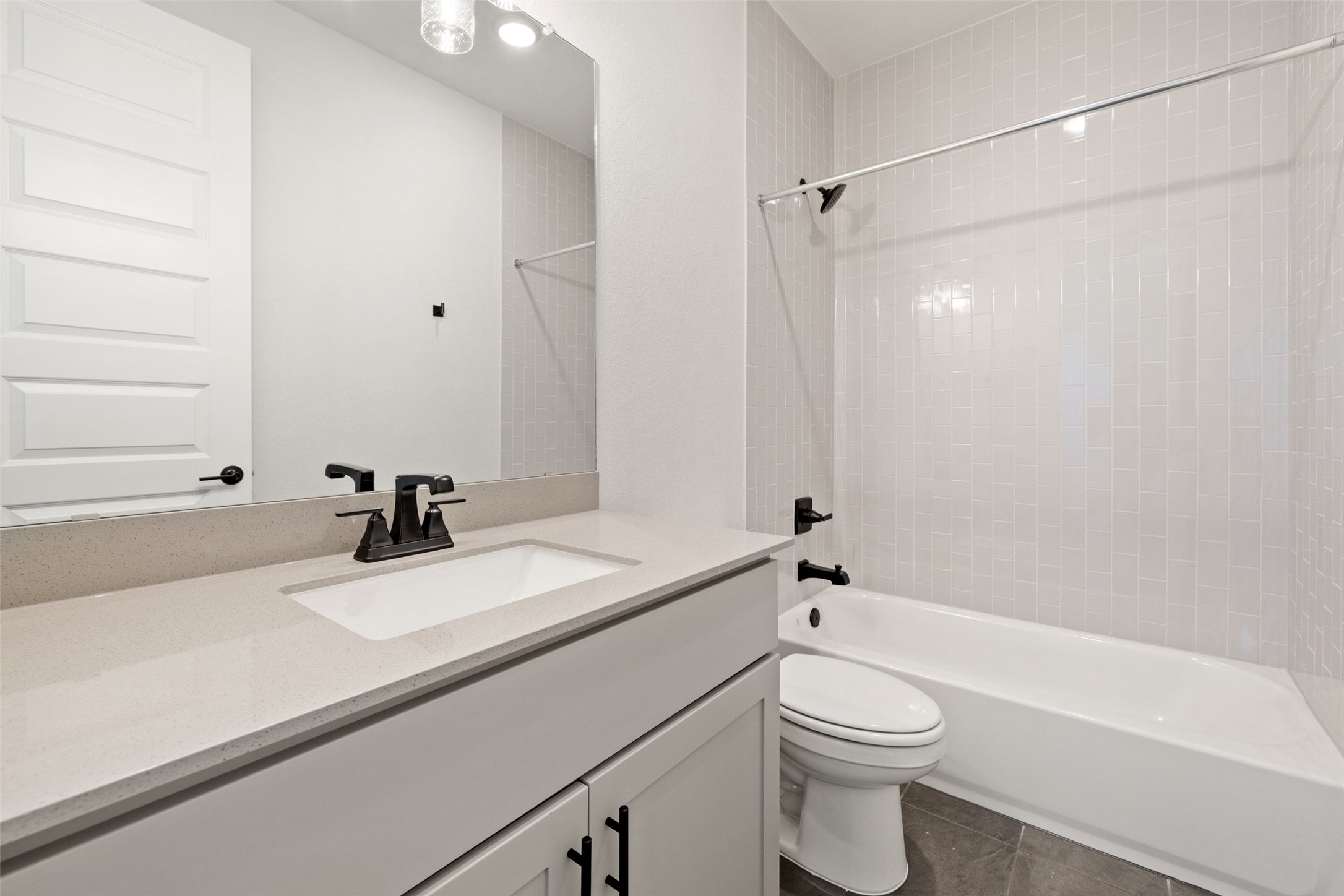 16309 Smithers Road Manor, TX 78653 - Photo 30 of 40 a bathroom with a sink a toilet and a bathtub