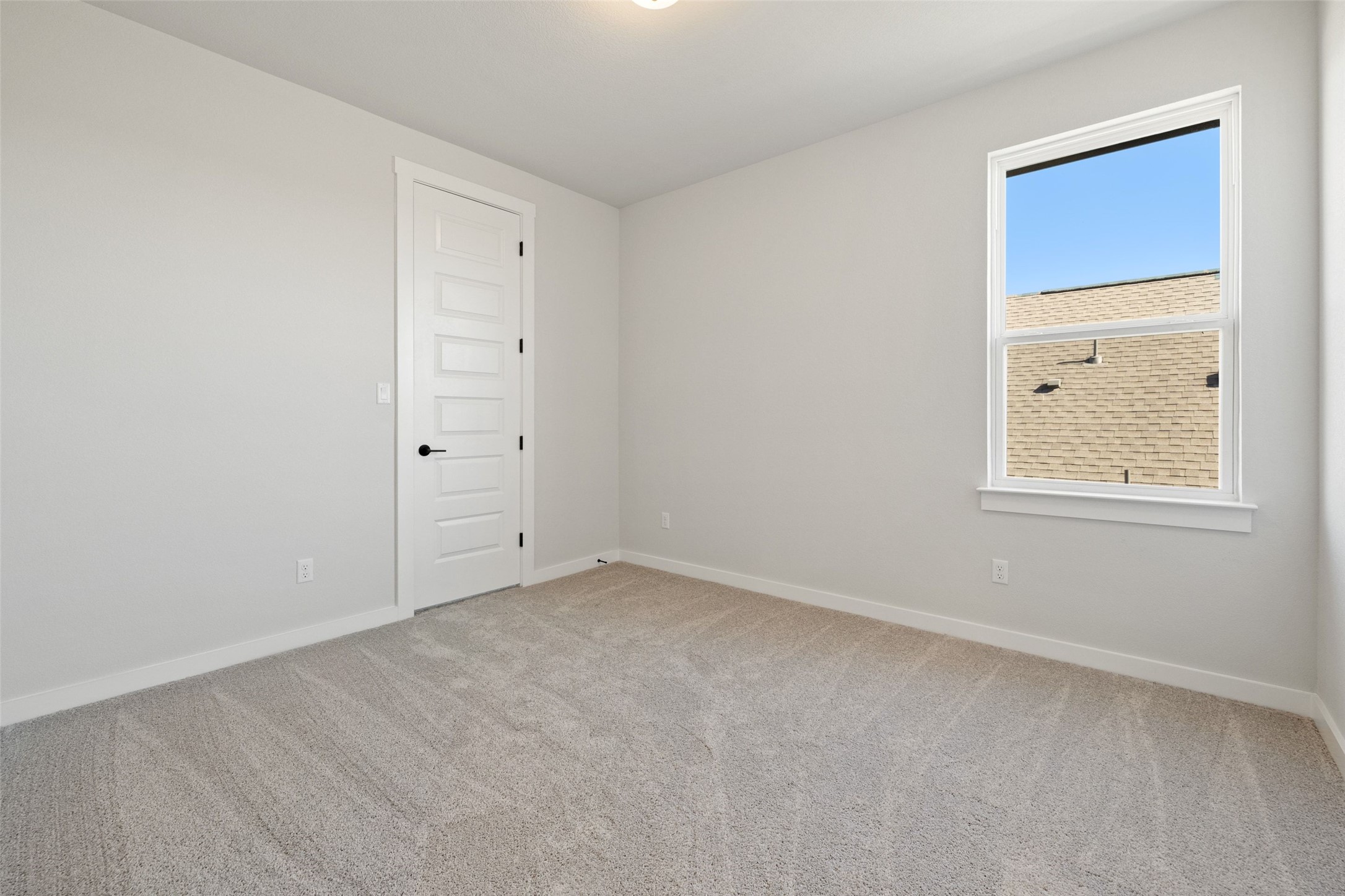 16309 Smithers Road Manor, TX 78653 - Photo 31 of 40 an empty room with windows