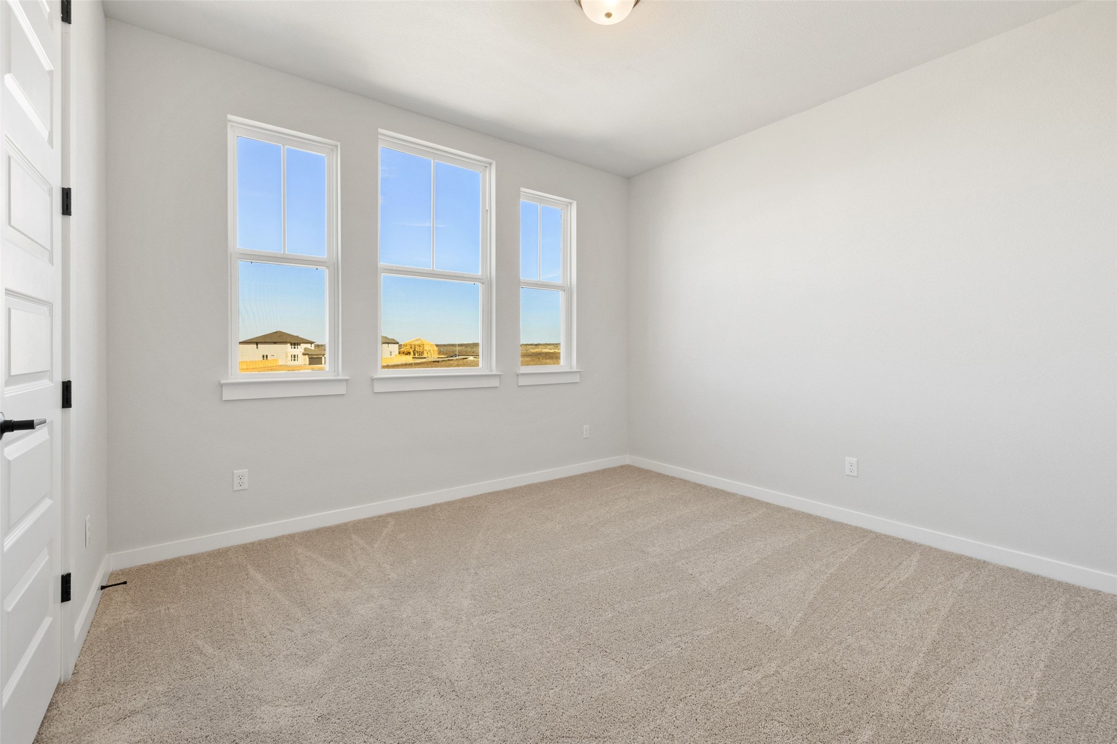 16309 Smithers Road Manor, TX 78653 - Photo 34 of 40 an empty room with windows