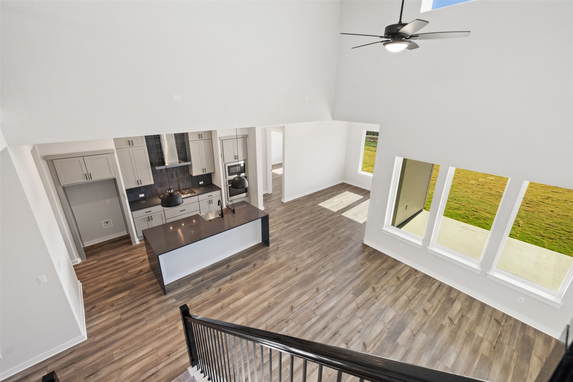 16309 Smithers Road Manor, TX 78653 - Photo 35 of 40 a living room with furniture and a wooden floor